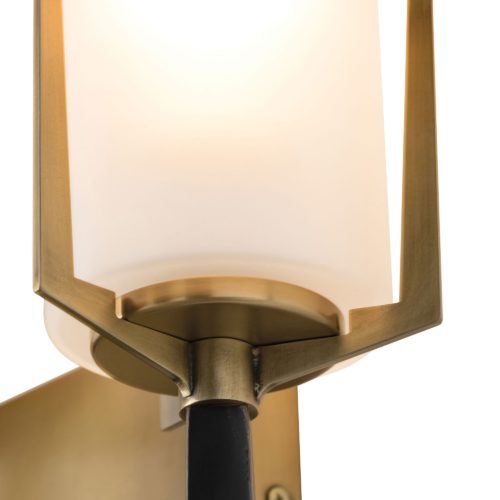 A torch for the new age, this stunning sconce is a unique option for true design enthusiasts seeking something with flair. Frosted glass shades diffuse the light, creating a soft glow that contrasts the sharp angles and bronze finish with antique brass details.