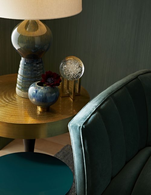 interior setting with accent tables, lamp, and decorativeaccessories