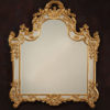 Louis XV style carved wood rectangular mirror with leaf and scroll design, antiqued goldleaf finish and beveled glass; Hand made in Italy; available at www.InvitingHome.com