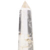 Stunning clear and purple rock crystal obelisk in polished brass setting nested atop of a black crystal base