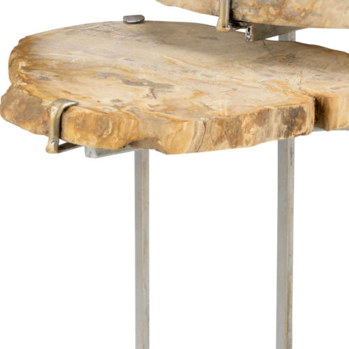 Set of 2 nested tables with tops made of solid petrified wood and antique silver leaf finish on bases.