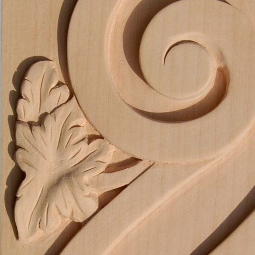 Santa Monica wood brackets are carved in a deep relief with grape cluster motif on the front and grape leaf scroll on the sides