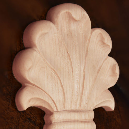 Baltimore wood plaques are carved in a deep relief with leaf motif