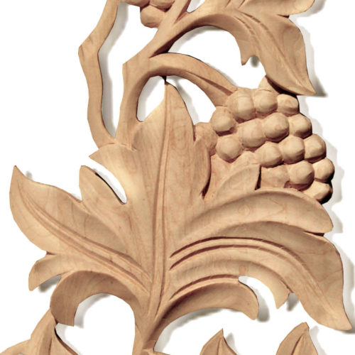 Wood carving features carved in deep relief elegant grape vines with grape clusters