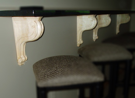 Chicago carved wood brackets supporting a granite shelf