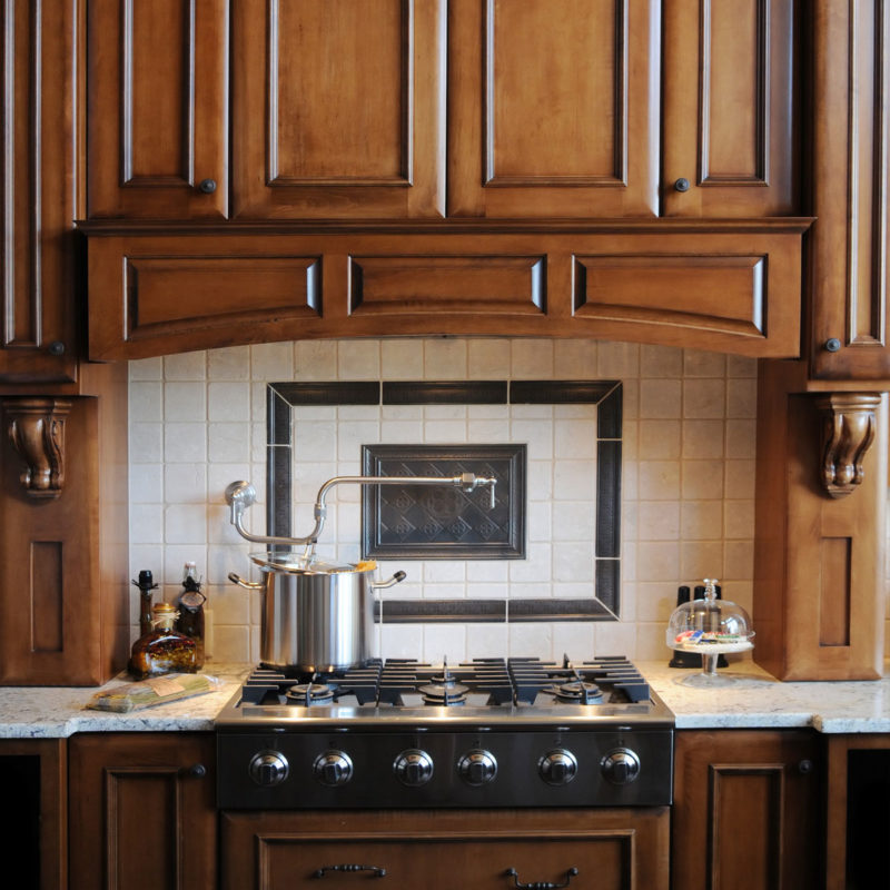 classic kitchen cabinets with elegant carved wood corbels; kitchen design ideas; kitchen inspiration