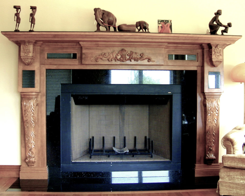 Classic fireplace mantel with corbels and carvings; interior design ideas