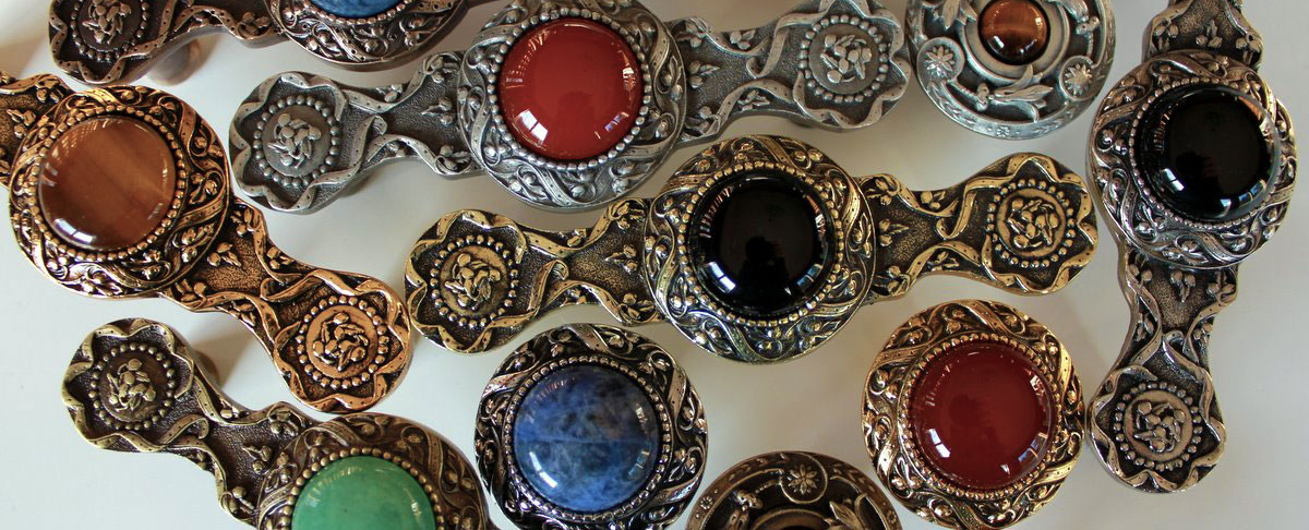 Collection of knobs made of pewter or bronze with semi-precious stone inserts. All stone knobs are jeweled in USA. Knobs available with tiger eye semiprecious stone, onyx semi precious stone and many other stones