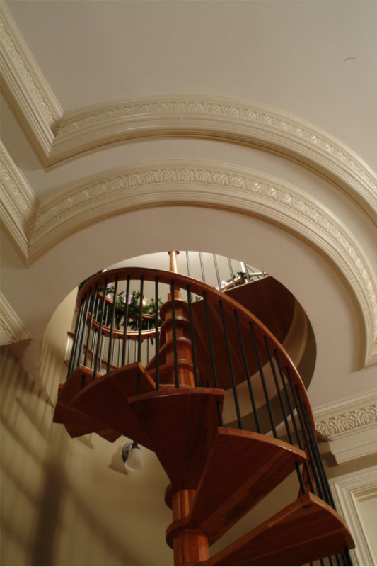 flexible crown molding design around spiral staircase; flexible molding ideas