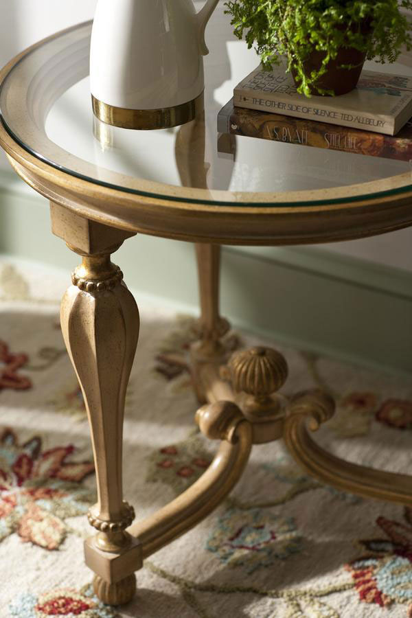 Scottish style round accent wood table in hand-painted antiqued ivory finish with antiqued goldleaf accents; available at InvitingHome.com