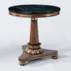 Biedermeier style round wood table with carved leaf motif. Table has hand-painted faux burl finish and antique gold-leaf trim. Biedermeier table is made with black Marquina marble top. Biedermeier style table is hand-crafted in Italy
