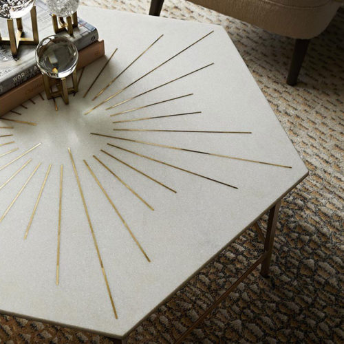 coffee tables; This exquisite coffee table is like bringing the brilliance of the sun into a space. Honed hexagonal white marble is inlaid with 30 slices of polished brass, forming a shining sunburst design that is elegant and oh-so-sophisticated