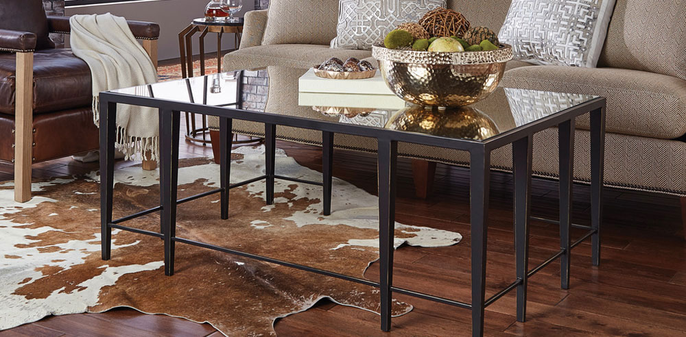 This sophisticated Industrial Coffee Table has dark bronze finished legs, accenting the antique mirror. Coffee table is perfect for large open rooms, perfect to add to your mixed metal decor