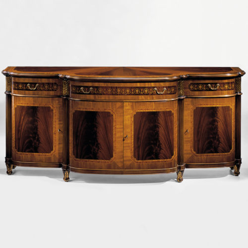 Hand-crafted Regency style four door inlaid credenza. This stunning credenza features mahogany veneer and cross-banded inlay of satinwood, rosewood and ash burl. Regency credenza has three inlaid drawers, three compartments with one shelf inside, carved wood capitals in antiqued gold-leaf finish and antiqued brass hardware. This inlaid credenza is hand-made in Italy