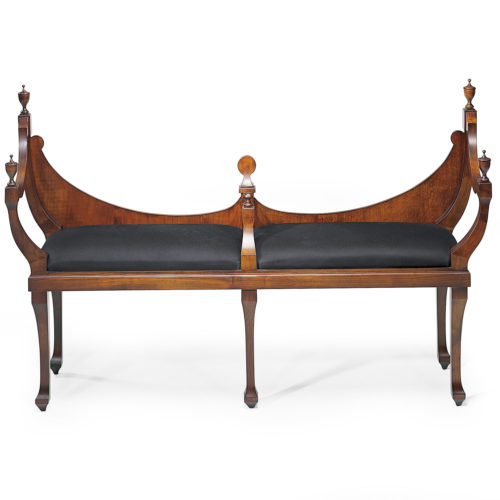 Open crescent back maple settee in mahogany finish, with carved urn finials. Settee upholstered in black muslin. This settee is hand-crafted in Italy