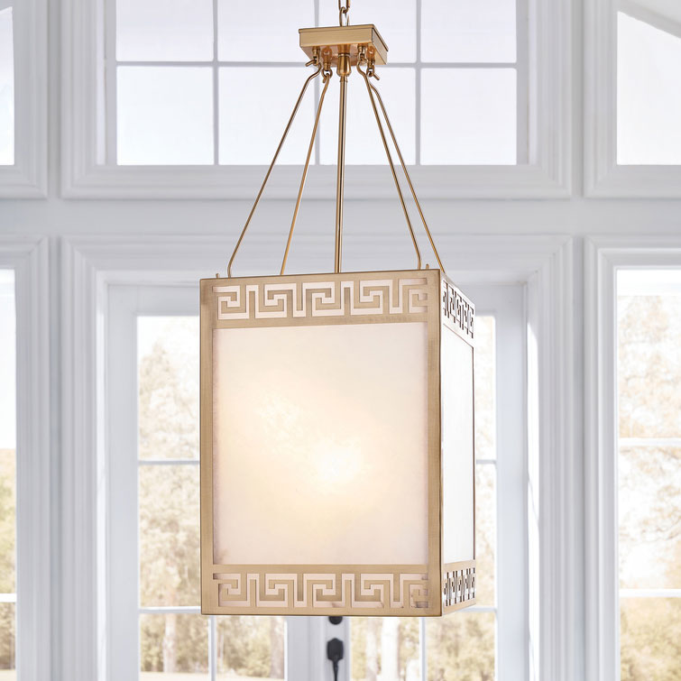 New contemporary classic, this handsome lantern will add a touch of timeless design to any space. Open work design with Greek key motif featured on wrought iron frame in antique brass finish.? The lanterns panels are made from all natural white alabaster