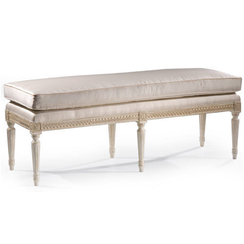 Louis XVI style carved wood bench with antique white finish. Bench has loose cushion and off-white upholstery. This bench is hand-crafted in Italy