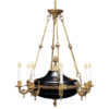 This sophisticated Empire style eight light chandelier is hand crafted in Italy from solid cast brass. Chandelier is finished in French gold and has a black accents. This chandelier is hand-crafted in Italy