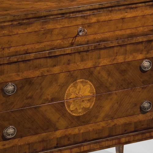 Hand-crafted Maggiolini style inlaid chest. This chest features black walnut veneer inlaid with walnut, olive, boxwood and rosewood. Maggiolini chest has three drawers and antique brass hardware. This inlaid chest is hand-made in Italy