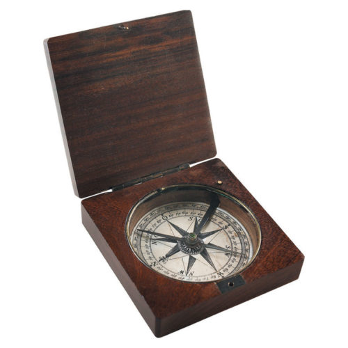 Lewis-and-Clark compass in lightly distress rosewood box. A needle pointing north... Antique science captured in admiralty brass... Allowing sailors to cross vast oceans, explorers to discover continents. Set sail for the fabled Spice Islands, legendary Cathay, rumored South Lands.