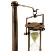 Heavyweight bronze 30 minute hourglass on wood stand. This hourglass designed for the Age of Sail, now at home in any oval or executive office.