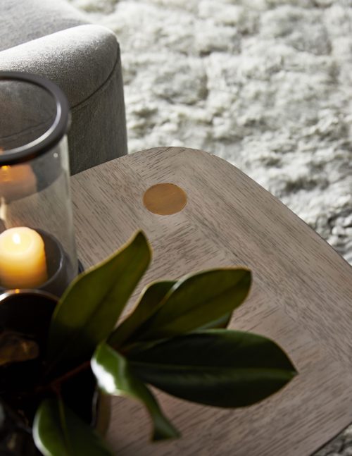 side table with decorative hurricane candle