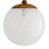 Varying sizes of opal swirl glass globes embellish a sleek and slender steel frame that works to ground the slightly whimsical design. Small, clearcrystal knobs contrast beautifully with the antique brass finish