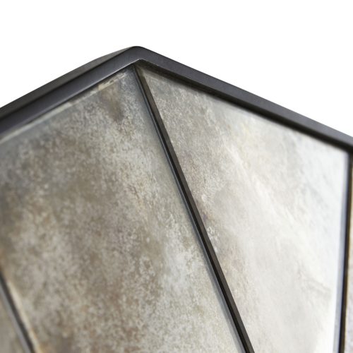 A unique geometric pattern surrounds the hexagon-shaped glass center, creating a reflective tortoiseshell appearance. Framed in natural iron, the heavily antiqued, outermirrored panels provide warm and cool tones that accentuate a more lightly antiqued, and functional central mirror.