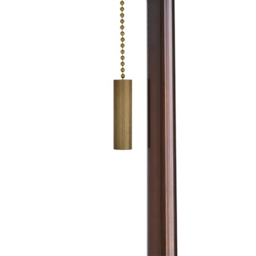 Sleek and sophisticated, this double-socket iron floor lamp features a slender metal column supported by a round open-base foot in an antique brass finish.