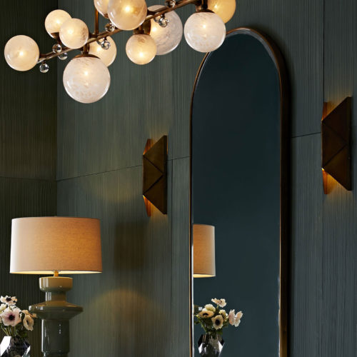 Elegant interior decor with contemporary chandelier and sconces; home lighting ideas; lighting and decor inspiration