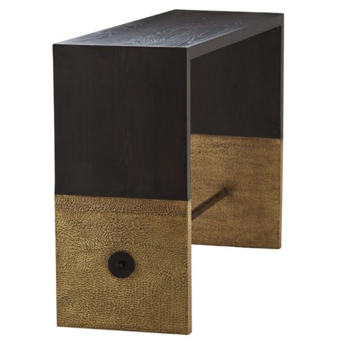 The brass clad sabots wear decorative pitting like a coat of armor fit with an iron spear. The cerused sable stain enhances the oak grain, highlighting the attention paid to this finepiece of furniture. Finish may vary.