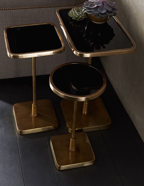 Polished brass on the base and lip contrast beautifully with the vintage brass pedestal and black mirror top.