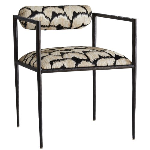 This exquisite frame is perfectly poised, perched on delicate legs that are as faint as insects'. The natural iron body has been hand-forged, yielding soft impressions along the sharp-angled frame. The tight seat and bolster back cushion are covered in a regal ocelot embroidered linen. Finish may vary.