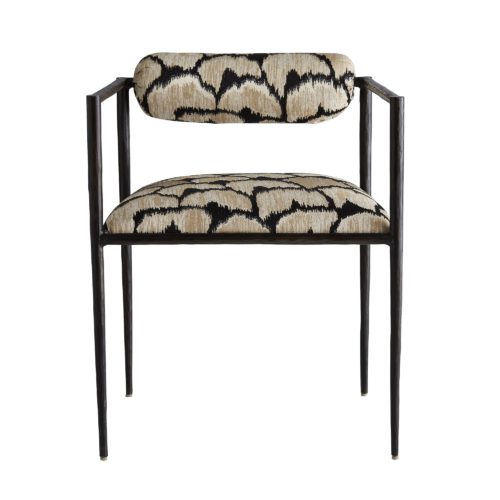 This exquisite frame is perfectly poised, perched on delicate legs that are as faint as insects'. The natural iron body has been hand-forged, yielding soft impressions along the sharp-angled frame. The tight seat and bolster back cushion are covered in a regal ocelot embroidered linen. Finish may vary.