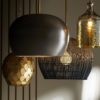 Group of modern pendant lights in various finishes.