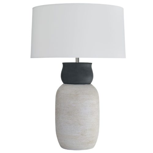 The foundation features a smooth neck in a midnight terracotta finish that blends seamlessly into the textured base in awhitewash finish. This contrast of tones and textures creates unique visual movement along its façade. Topped with an off-white cotton drum shade with off-white cotton lining and a matching finial.