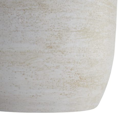The foundation features a smooth neck in a midnight terracotta finish that blends seamlessly into the textured base in awhitewash finish. This contrast of tones and textures creates unique visual movement along its façade. Topped with an off-white cotton drum shade with off-white cotton lining and a matching finial.