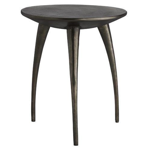 seemingly simple table has details that make it quite extraordinary. It is crafted entirely from cast aluminum, finished in a graphite tone that gives it a slightly Brutalist and tribal look, though updated in a polished, modern silhouette.