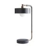 This contemporary lamp possesses a modern sensibility defined by a sleek style and masterly materials. A heritage brass steel frame wrapped in gray leather seamlessly blends into a circular black marble base—abeautiful balance between natural and refined elements.