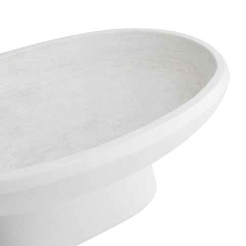 Concrete is molded and finished in a stark white to create the tabletop structure, which features a profound, bowl-like top that rests upon a slightly tapered, boat-like base. Its versatile design allowsthis piece to complement both traditional and modern decor—it also doubles as an outdoor planter.