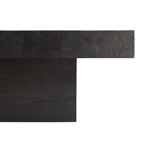 Crafted from blackened wood, which is first sandblasted to give an intense, charred wood finish that you can see and feel. The top uniquelyhas an added brushed texture, and a slight gloss is achieved from a final wax coat, delivering a modern polish. The large-scale top extends over the base to create a floating effect--a great focal point for a contemporary living space.