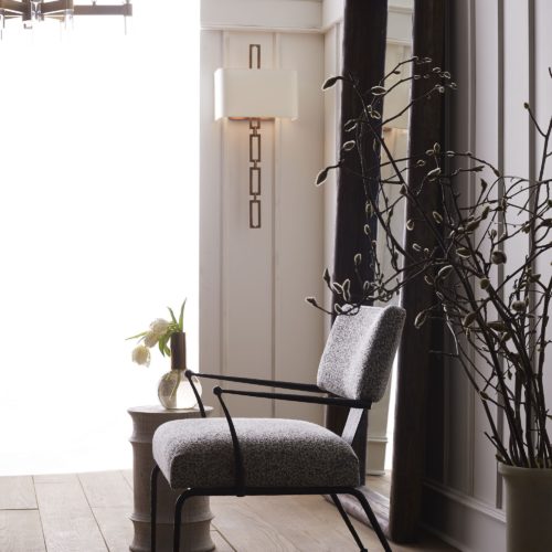 elegant black and white armchair with natural iron frame. Armchair has natural fabric that can go with any living space.