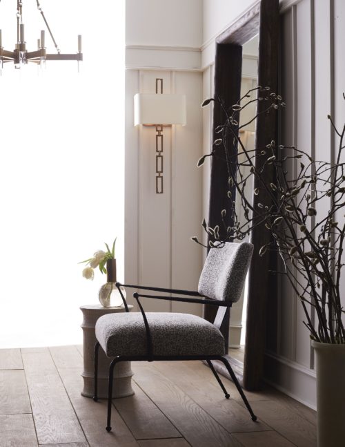 elegant black and white armchair with natural iron frame. Armchair has natural fabric that can go with any living space.