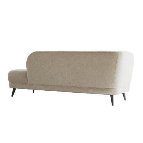 It is designed in a modern way, but softened with rolling curves, rounded angles and an extra plush seat. Up close, observe all the immaculate details, likecorner pleating, self welting and grey ash finished tapered legs. Upholstered with a textural boucle in a soft shade of pale gray, this hue complements a palette of almost any range.