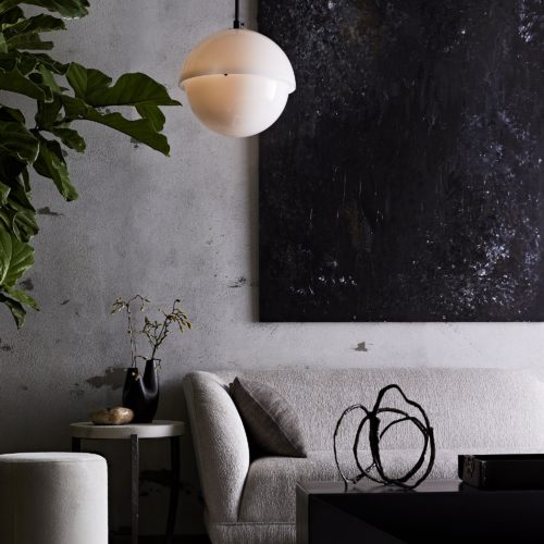 Grays and blacks make for this modern-industrial inspired living room. Add the boucle chaise lounge to soften up your room, adding comfort with bold accents.
