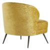 The curved back gives you ample support, while the sloping arms keep you curled up inside.Upholstered in a plush, marigold velvet with welting details to accentuate the curves. The base rests on tapered, light bronze finished metal legs that have a hint of glisten.