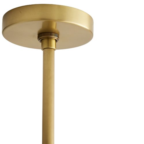 Finished in antique brass, the cylindrical center features several slender arms that spider out in a diamond-like formation to showcase sixteen mushroom-shaped opal glass globes. The connection between the glass and the steel is cleanand concise—visually streamlining this piece. Oversized, this luxe light is a great solution for personal or professional spaces in need of a little (or a lot!) of luster.