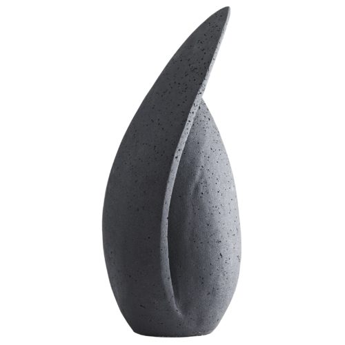 The artistry of sculptural work is showcased in the uniqueness of this ricestone form. Carved in a teardrop shape, one side prominently peaks over the top in a sweeping fashion, delivering an unexpectedabstract quality to this statuesque piece. A charcoal finish delivers a moody aesthetic and modernizes its natural composition