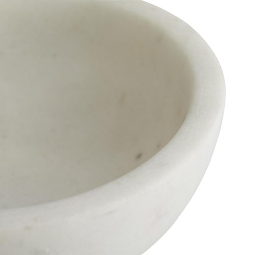Smooth white marble creates a bowl-shaped form that is showcased on a white marble platform and accented by a thin antique brass belt. Elevates a space instantly, whether in use as a snack bowl or a catchall container.