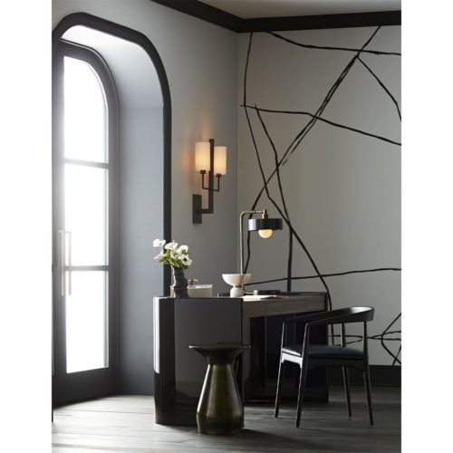 Chic and modern home office. This elegant work space is fitted with curved walnut desk with black and white accents.